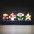Paladone Super Mario Bros. Icons Light, a 30cm wide lamp featuring Mario, a mushroom, a flower, and a star, lit up