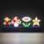 Paladone Super Mario Bros. Icons Light, a 30cm wide lamp featuring Mario, a mushroom, a flower, and a star, lit up