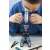 Child using the BUKI Microscope 30 Experiments STEM Toy to examine a sample