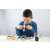 Child using the BUKI Microscope 30 Experiments STEM Toy to examine a sample