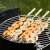 Barbecook BC-ACC-7068 4-piece skewer set with wooden handles, 43cm, FSC certified, used for grilling shrimp