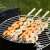 Barbecook BC-ACC-7068 4-piece skewer set with wooden handles, 43cm, FSC certified, used for grilling shrimp