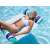 Woman relaxing on a green and blue striped inflatable mesh pool float in a swimming pool