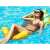 Woman Relaxing on Inflatable Pineapple Water Hammock
