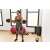 Woman using ModernHOME adjustable dumbbell set, 20kg, black and red, for a bicep curl exercise