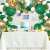 Jungle Safari balloon arch kit used as a backdrop for a birthday party with a cake and decorations