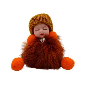 Giftdesign Pufamo brown fuzzy keychain with a sleeping baby doll wearing a yellow knitted hat - Keychain