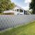 Grey privacy fence with Gardlov Belátásgátló tape installed