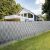 Gardlov gray privacy fence screen tape installed on fence