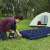 Inflating Bestway inflatable camping mattress with a foot pump