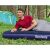 Man relaxing on Bestway inflatable mattress while camping