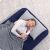 Woman sleeping on Bestway inflatable guest bed indoors