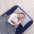 Woman sleeping on Bestway inflatable guest bed indoors