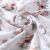 Close-up of BabyOno bamboo muslin fabric with rocking horse print