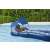 Man relaxing on Bestway Comfort Plush shaded lounge with canopy, blue and white, inflatable pool float