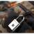 TrendGeek Fingerprint Padlock TG-131, silver padlock with fingerprint sensor, used on a camouflage backpack