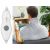 Man using electric neck and shoulder heating pad with remote control