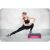 Woman stretching on NeoSport adjustable step pad, fitness and exercise