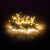 Illuminated Retlux RXL 233 warm white LED Christmas string lights on dark background