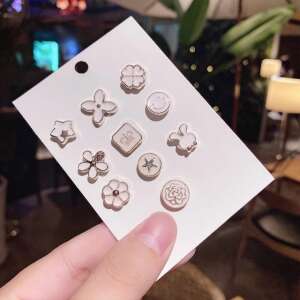 Set of 10 white brooches with different designs, including flowers, stars, a bunny, and a clover - Brooch