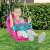 Child playing on pink unicorn baby swing, Dolu Smart Study Desk, outdoor play