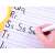 Child's hand writing on the Art Drawing Board Wordpad Set, yellow dry erase board with alphabet letters and lines for writing practice, comes with markers and eraser, educational toy for kids