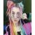 Woman with rainbow synthetic hair braids hairstyle