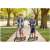 Two children riding Ricokids Kodi urban scooters in a park