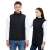 Heated vest with 11 heating zones, unisex, black, worn by a man and a woman