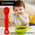 StartONTeam™ silicone baby spoon in use, red, BPA free, non-slip grip, for babies 4-24 months