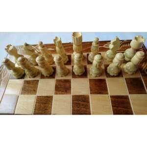 Chess pieces on a wooden chessboard - Toy