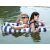 Couple enjoying a blue and white striped inflatable pool hammock on the lake