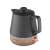 Concept RK0062 1200W electric kettle with ceramic and wood design, black and wood color, showing the red light indicator