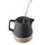 Concept RK0062 1200W electric kettle with ceramic and wood design, black and wood color, showing water being poured