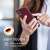 Woman holding a Burgundy Kwmobile Silicone Case for Nokia C32, Soft Touch