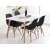 Black dining chairs with wooden legs in a dining room setting