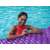 Woman relaxing on a Bestway Float 'n Roll inflatable pool float in a swimming pool
