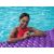 Woman relaxing on Bestway Float'N Roll inflatable pool mattress, purple, 213cm, 86cm, 90kg weight capacity