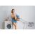 Woman with laundry basket next to washing machine and clothes dryer with Massido sock dryer