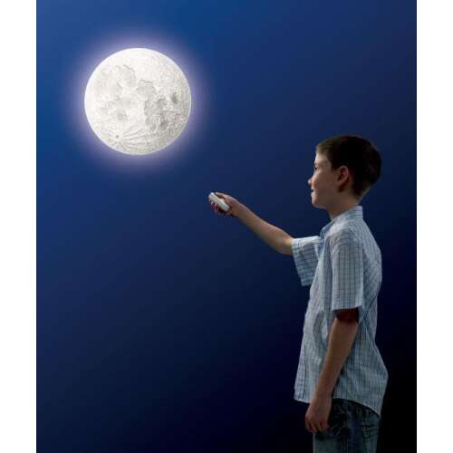 Brainstorm Toys My Very Own Moon STEM set with remote control, showing a boy using the remote to control the moon phases