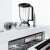 Bosch MultiTalent 8 food processor accessories, including blender, whisk, and various blades, on a countertop