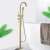 Blackswan M51.1 freestanding bathtub faucet in brushed gold finish, featuring a hand shower and a thickened base
