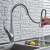 Blackswan M165 kitchen faucet with pull-down sprayer in use, chrome