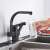 Blackswan M177 kitchen faucet, matte black, with pull-out spray, in use