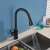Blackswan M195 kitchen faucet with pull-out spray head in use, matte black, 46 cm