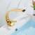 Blackswan M174 gold bathroom sink faucet installed in a bathroom