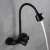 Blackswan M280 kitchen faucet, black, wall mounted, flexible spout, water flowing from the spout