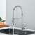 Blackswan M367 kitchen faucet, nickel model, with pull-out sprayer, in use, water flowing