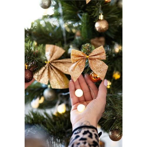 Zlatá trblietavá vianočná mašľa ozdoba umiestňovaná na stromček