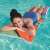 Bestway inflatable pool float, colorful design, woman relaxing on it